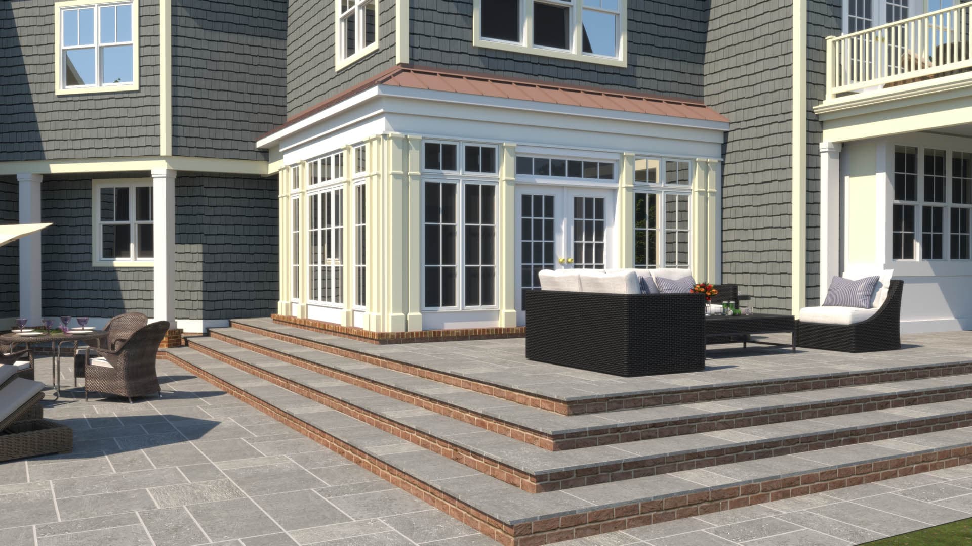 3D architectural rendering showing a glass sunroom addition with copper accent roof on a gray shingle-style residence, with a raised stone tile patio and wicker outdoor furniture
