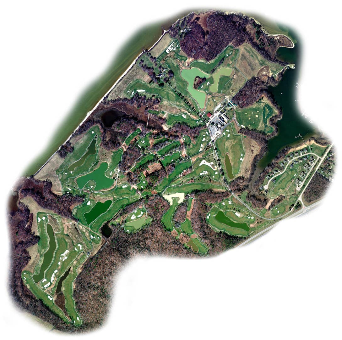 Aerial orthographic photograph of a full 18-hole golf course layout showing fairways, greens, sand bunkers, water hazards, and cart paths