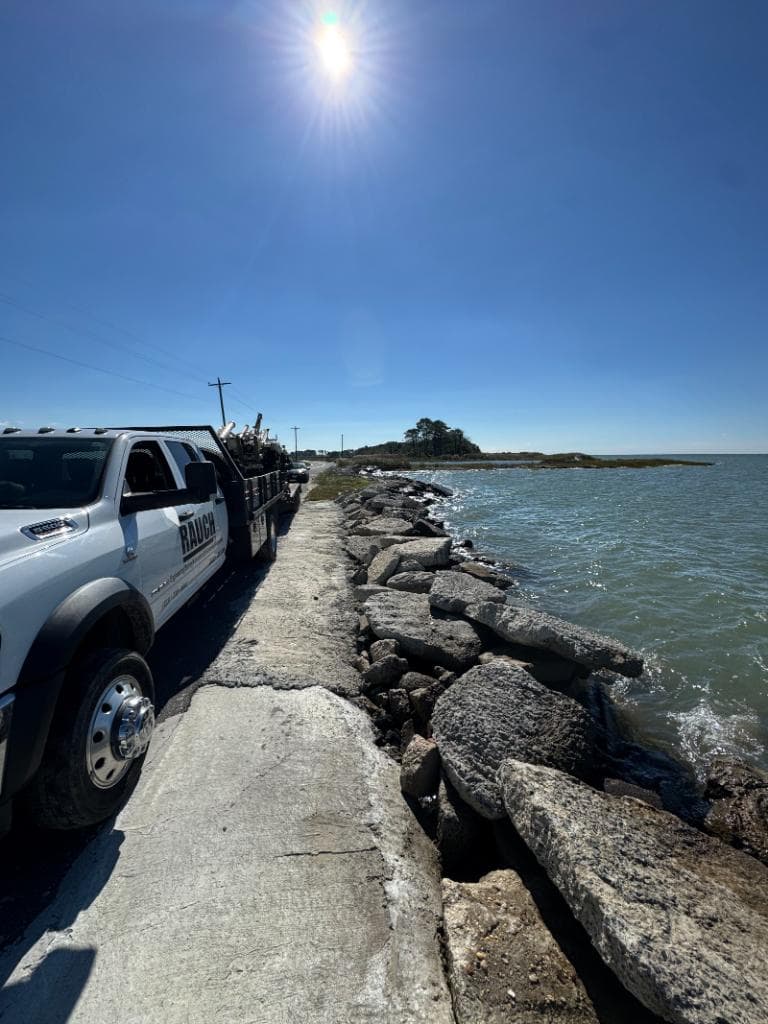 RAUCH truck along a Chesapeake Bay shoreline seawall during coastal assessment